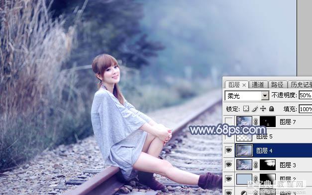 Photoshop为铁轨上的美女加上梦幻甜美的蓝色效果24